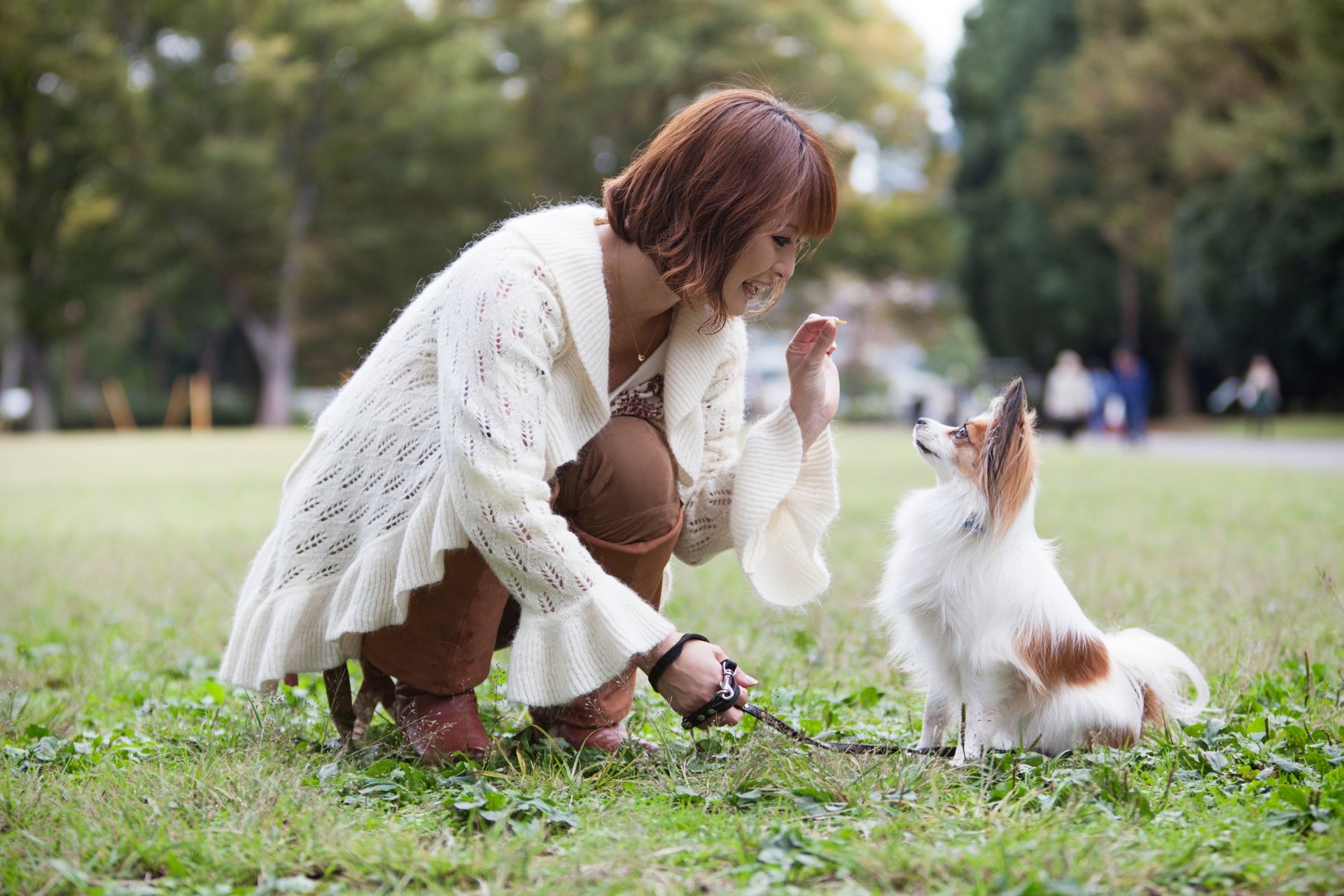 A woman training her dog